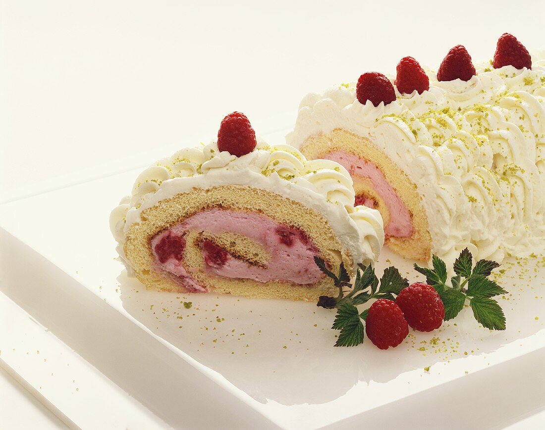 Sponge roulade with raspberry and cream filling