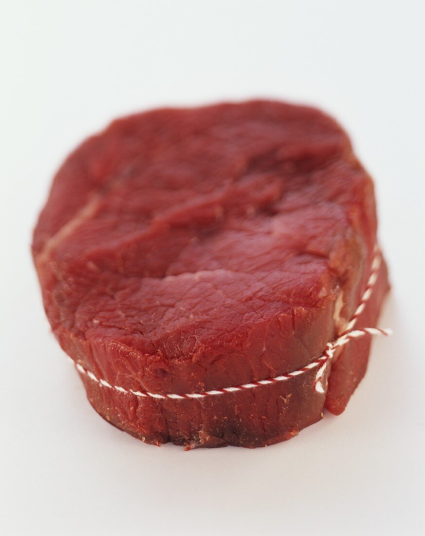 A piece of Chateaubriand, tied with kitchen string