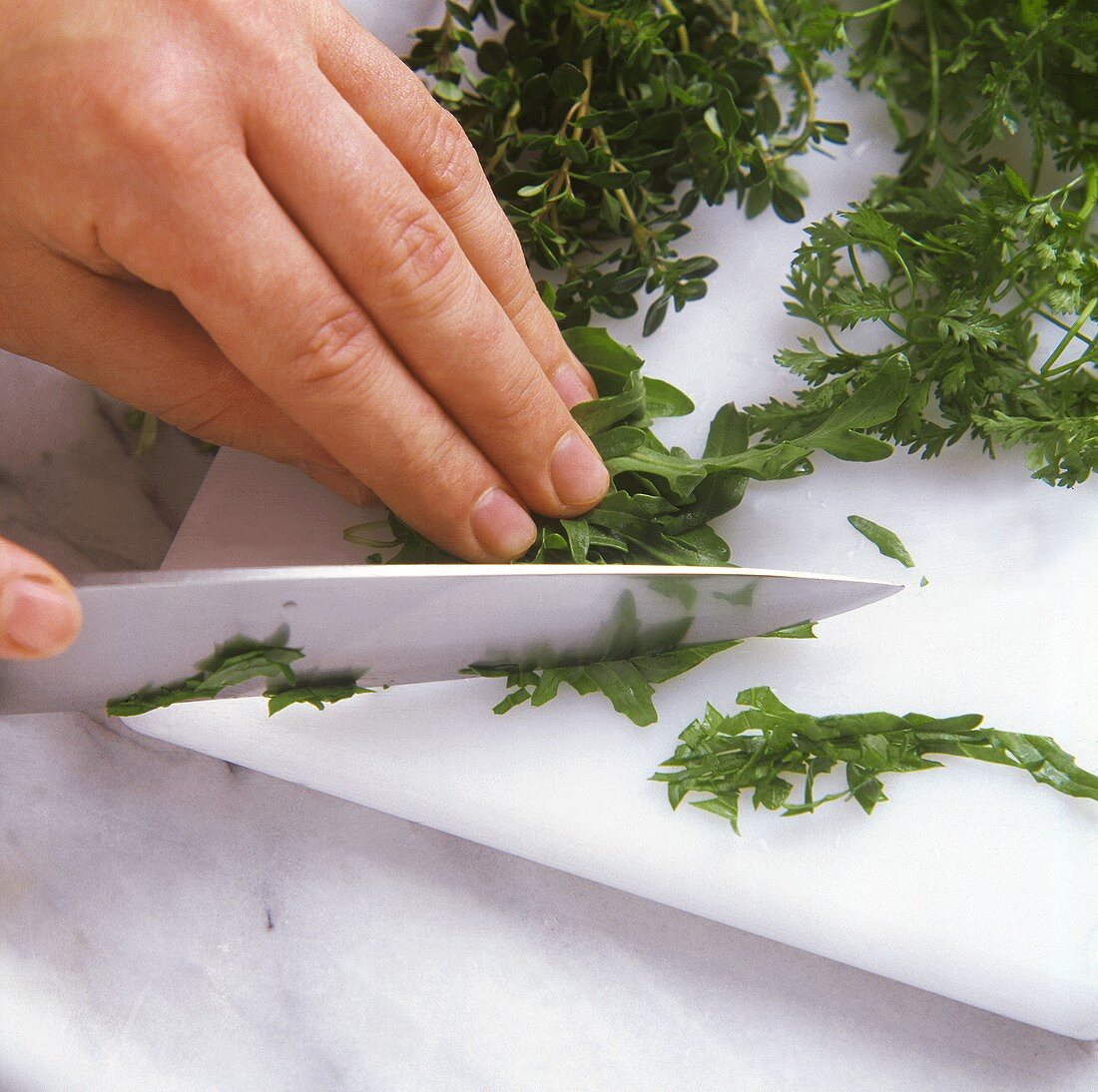 Chopping herbs with a knife