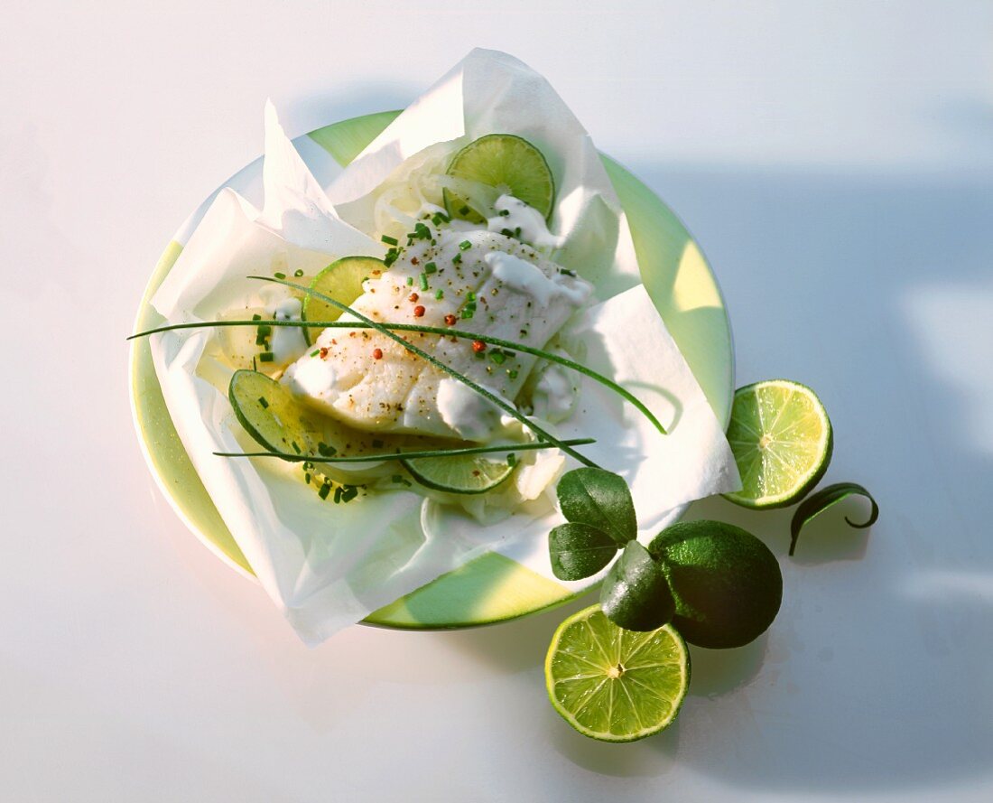 Steamed cod fillet on limes with cream fraiche
