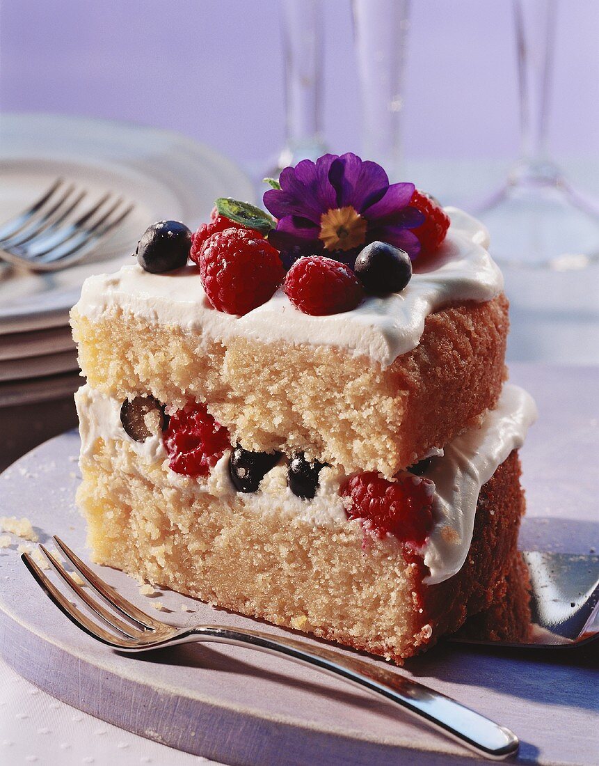 A piece of sponge gateau with berries