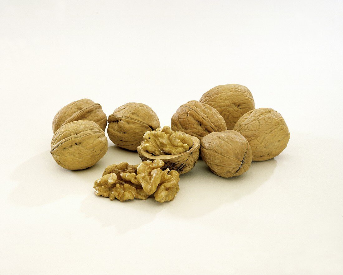 Several walnuts, one opened