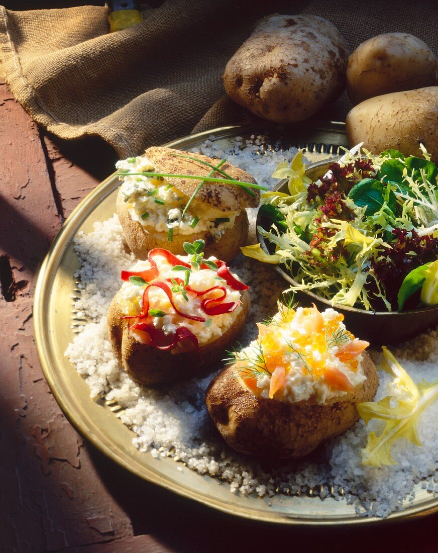 Baked potatoes with various soft cheese fillings