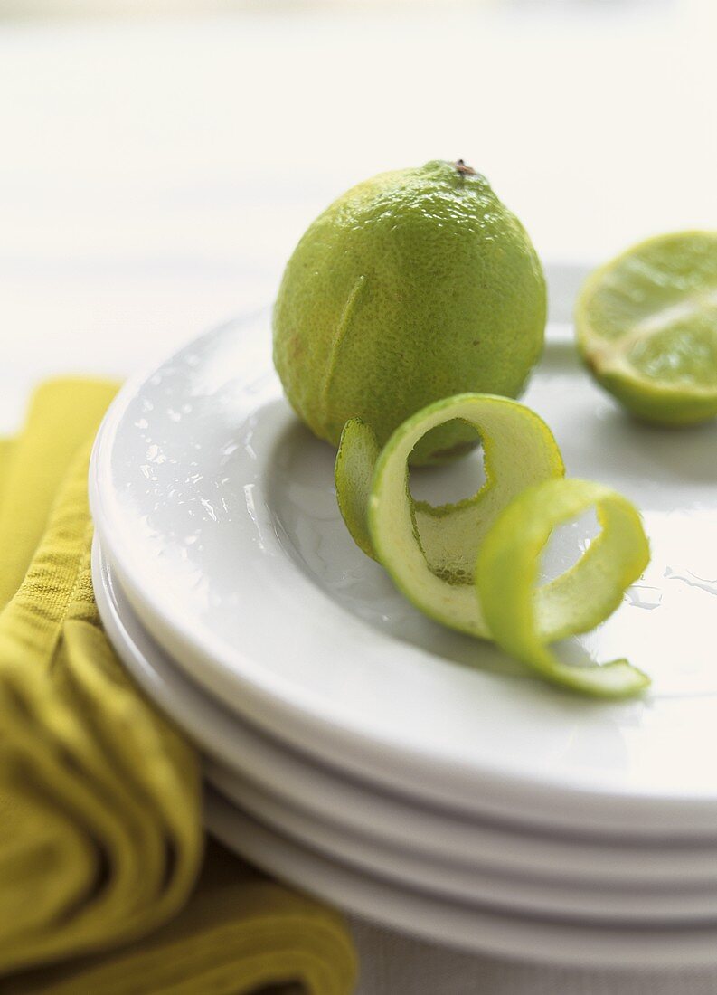 Limes and Lime Peel on Plate