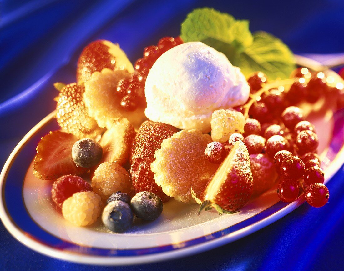 Berries with sponge and vanilla ice cream