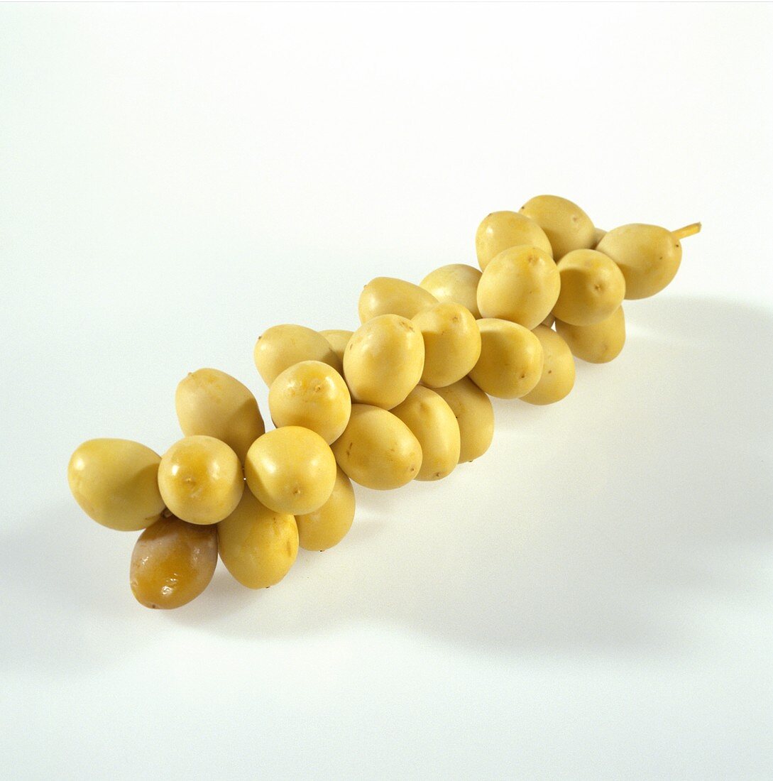 Yellow dates on the stalk