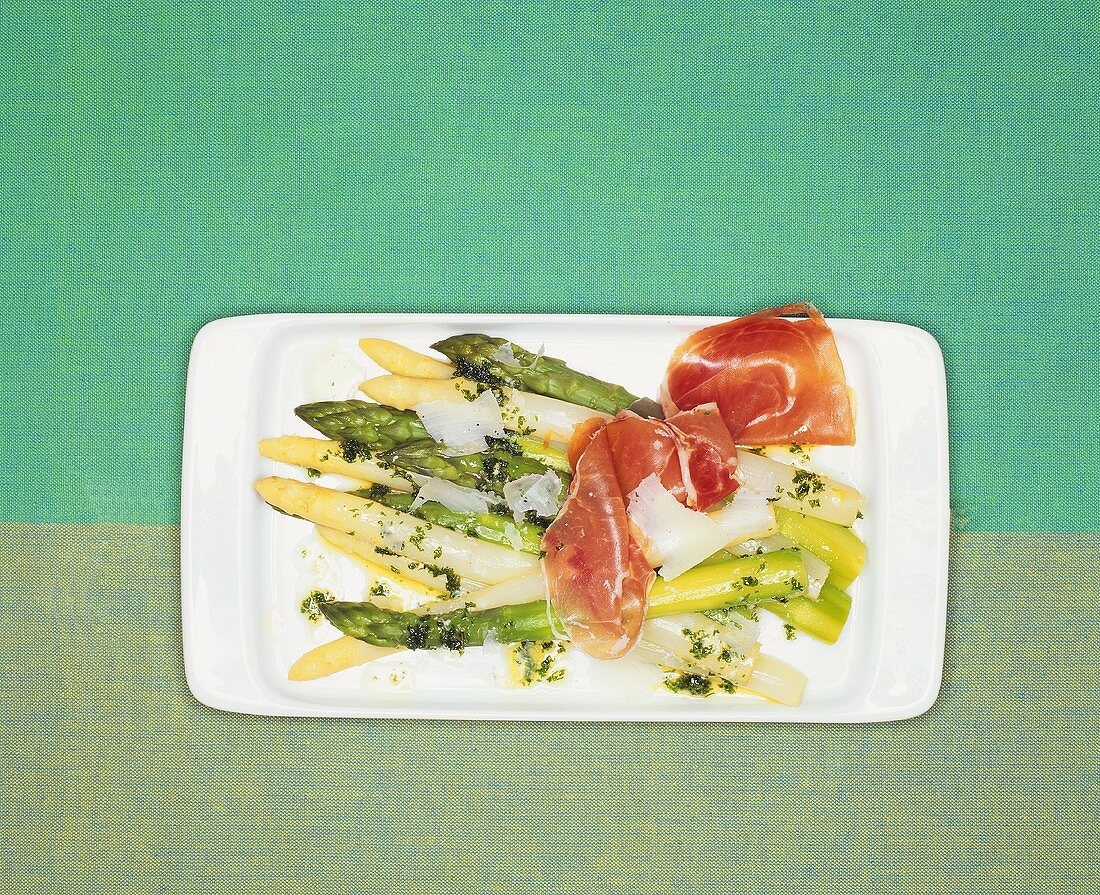 Green and white asparagus with ham and Parmesan