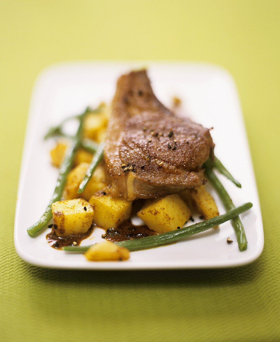 Lamb chops with curried potatoes and green beans