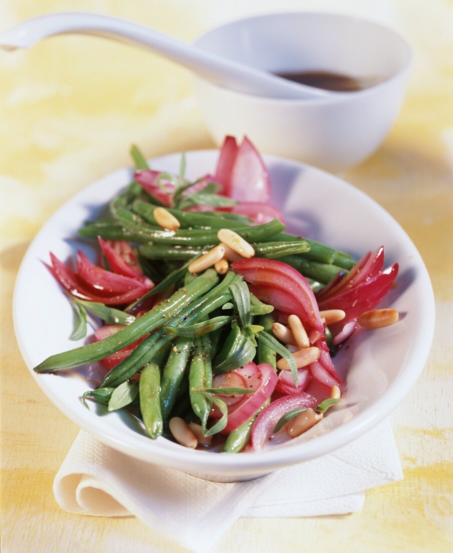 Green bean salad with red onions and pine nuts