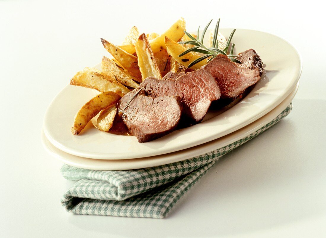 Marinated ostrich fillet with potato wedges