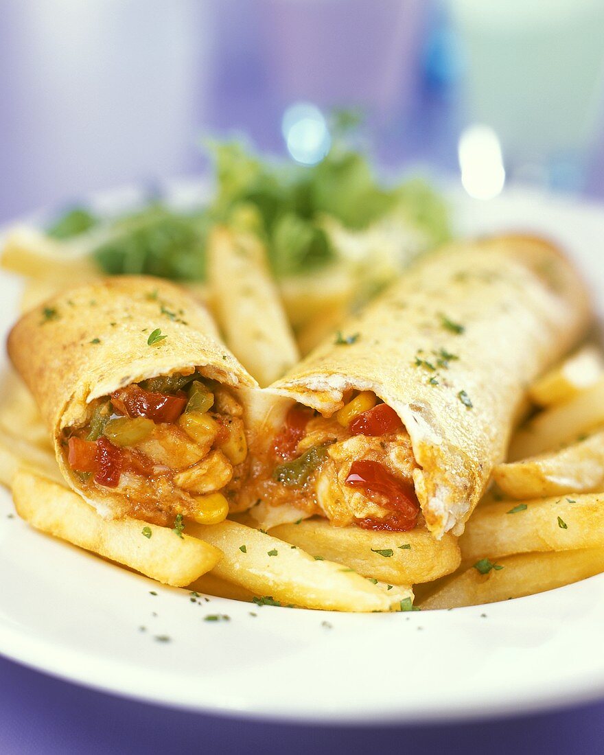 Wraps with chicken and vegetable filling and chips