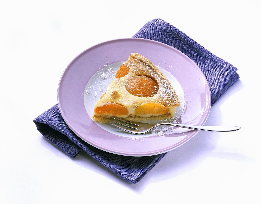 A piece of quark tart with apricots
