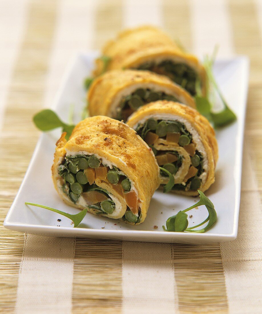 Omelette roulade with asparagus and carrot filling