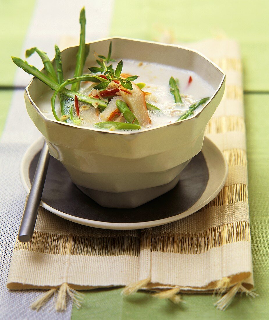 Coconut soup with asparagus and crab