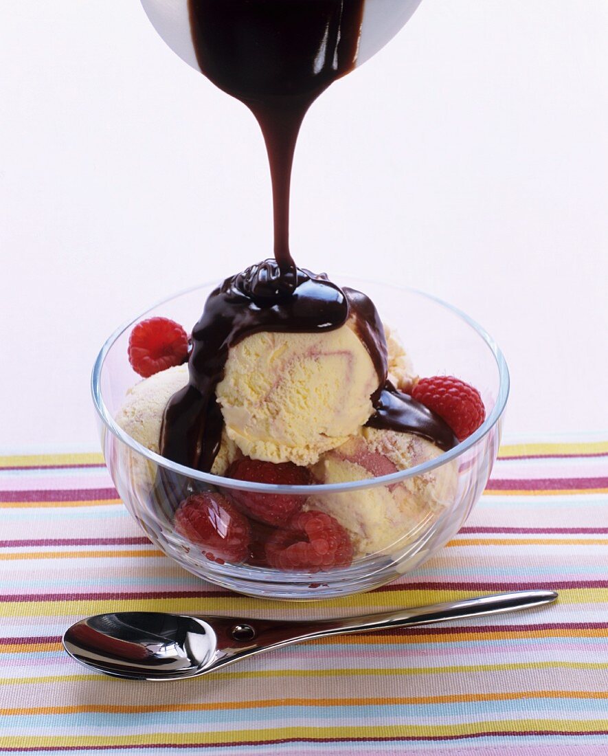 Vanilla & raspberry icecream with raspberries & chocolate sauce