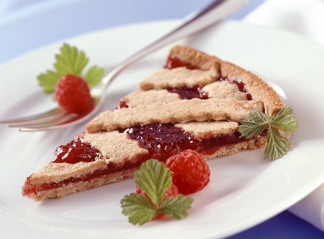 A piece of classic Linzer tart (with raspberry jam)