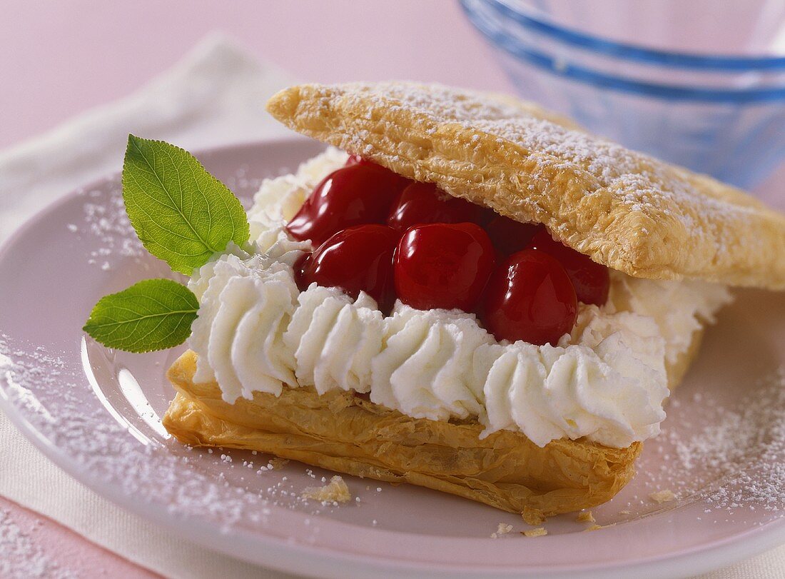 Puff pastry slices with cherry and cream filling