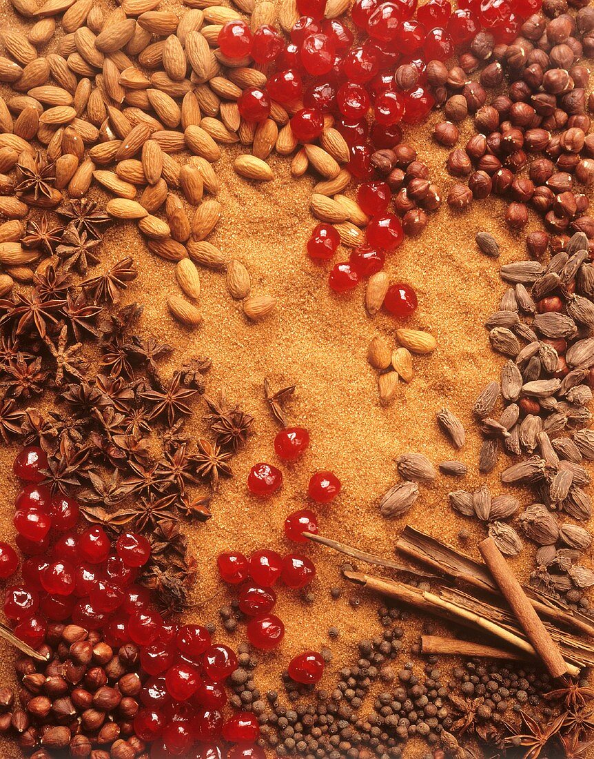 Spices, nuts, almonds and cherries forming a surface