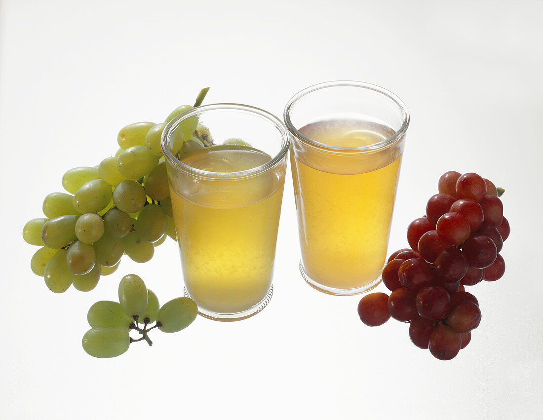 Must from red and white grapes in glasses