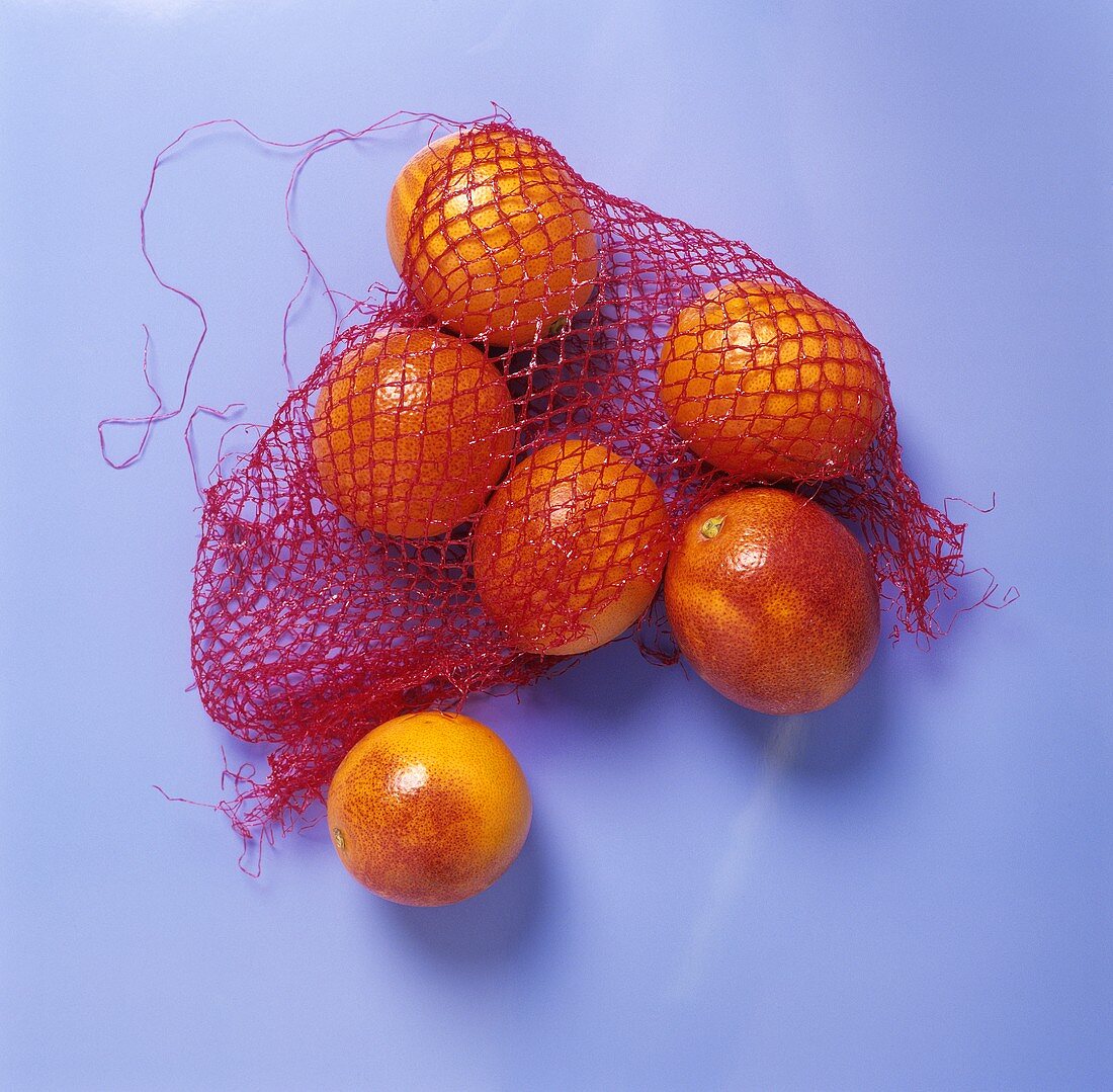 Blood oranges in net