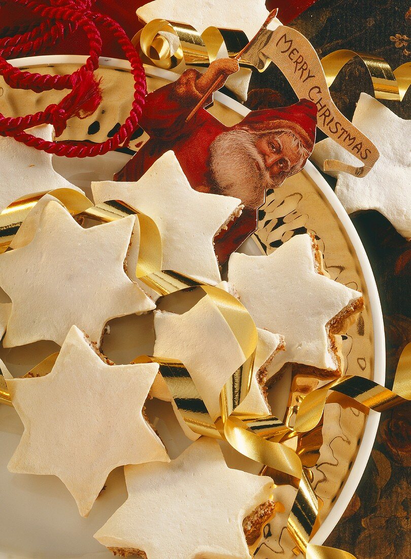 Cinnamon stars with Christmas decoration on plate