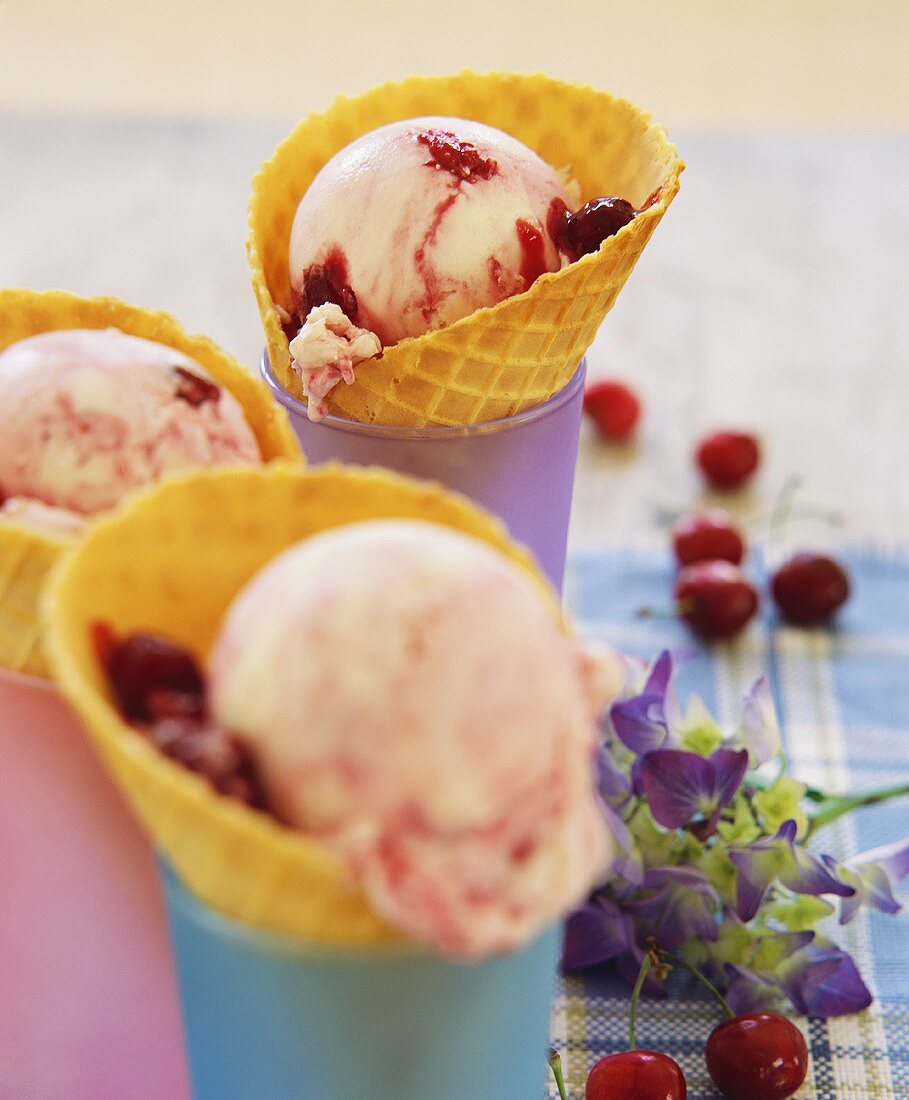 Cherry ice cream in ice cream cones