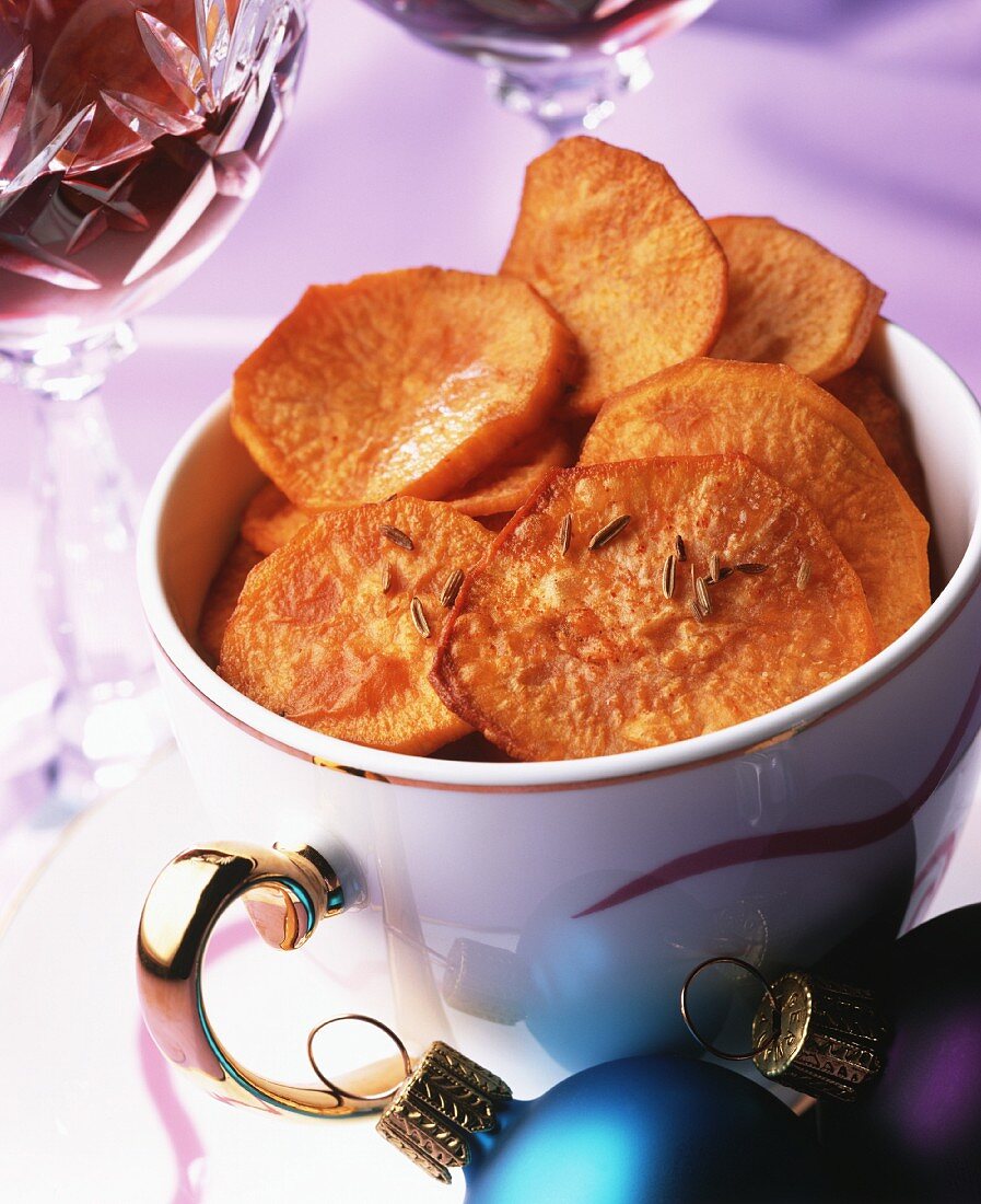 Deep-fried sweet potato slices with caraway