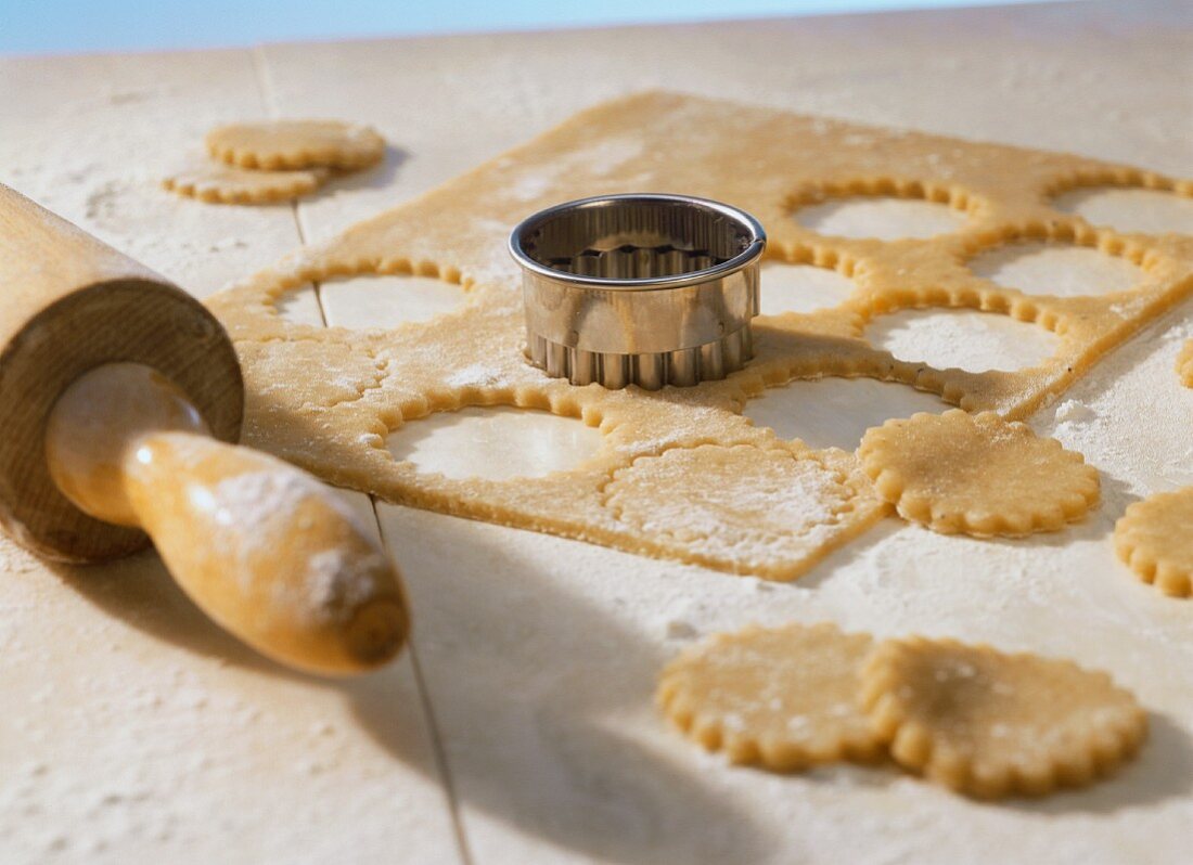 Biscuit dough with biscuit cutter and rolling pin
