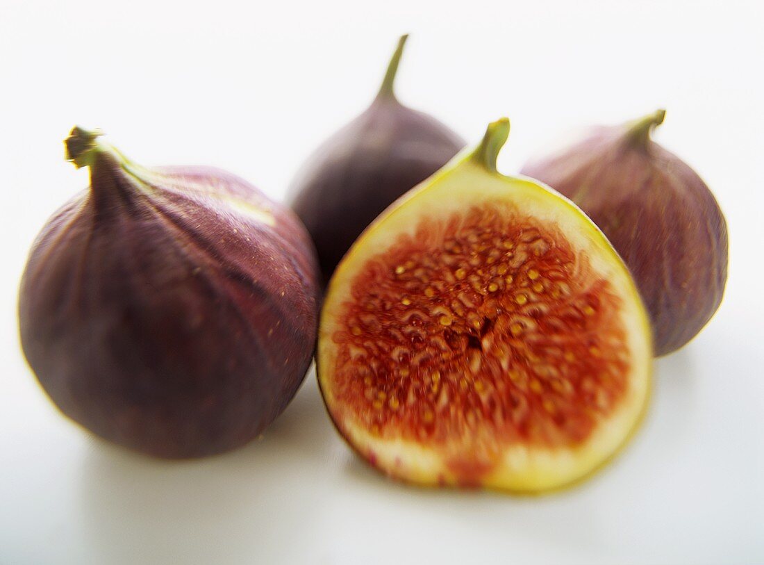 Halved fig in front of whole figs