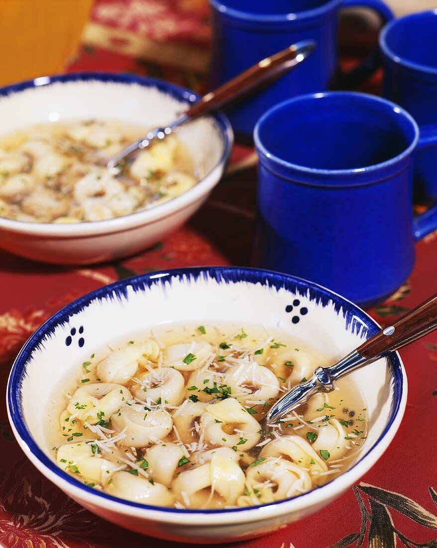 Clear broth with tortellini and Parmesan