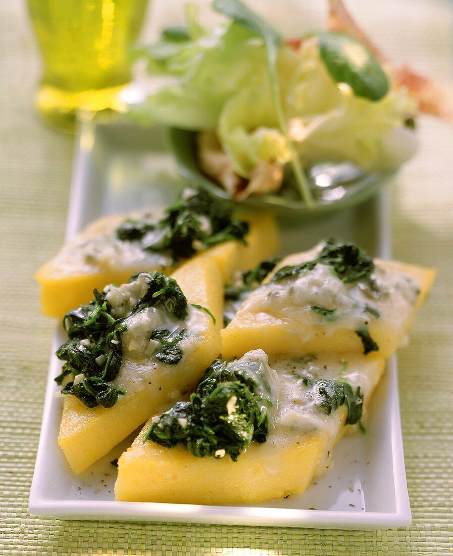 Polenta slices with spinach and gorgonzola