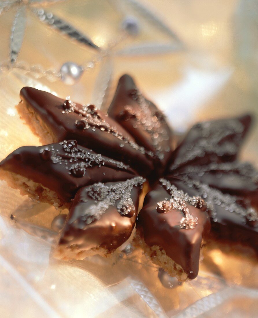 Oat and peanut diamonds with chocolate icing, forming a star