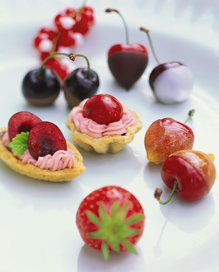 Small cherry cream cake, glace cherries & a strawberry