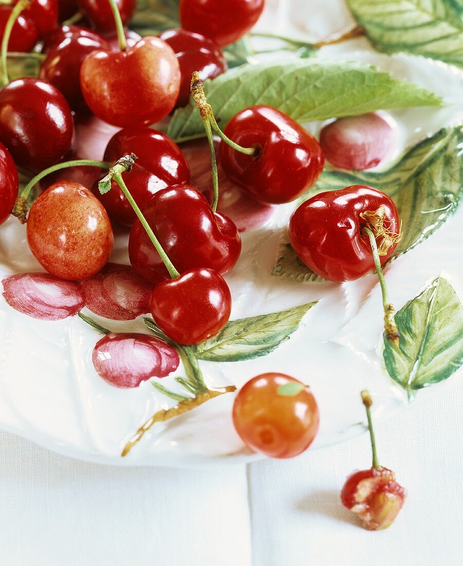 Cherries in a fruit bowl with cherry motifs