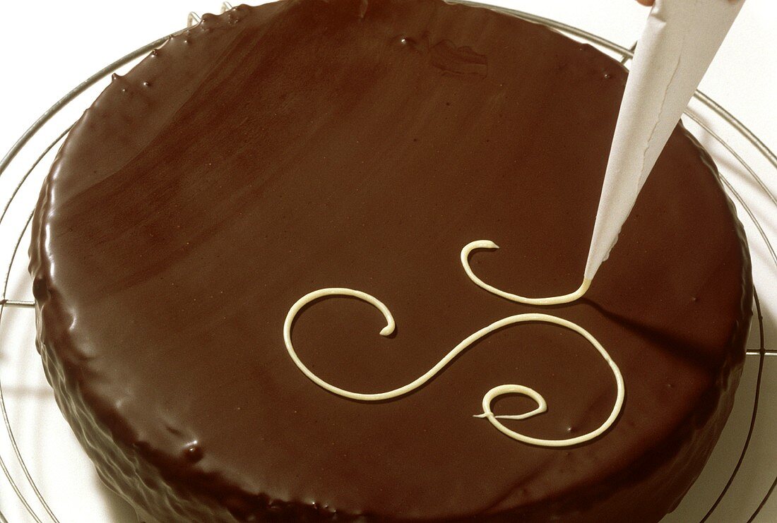 Decorating Sacher torte with writing