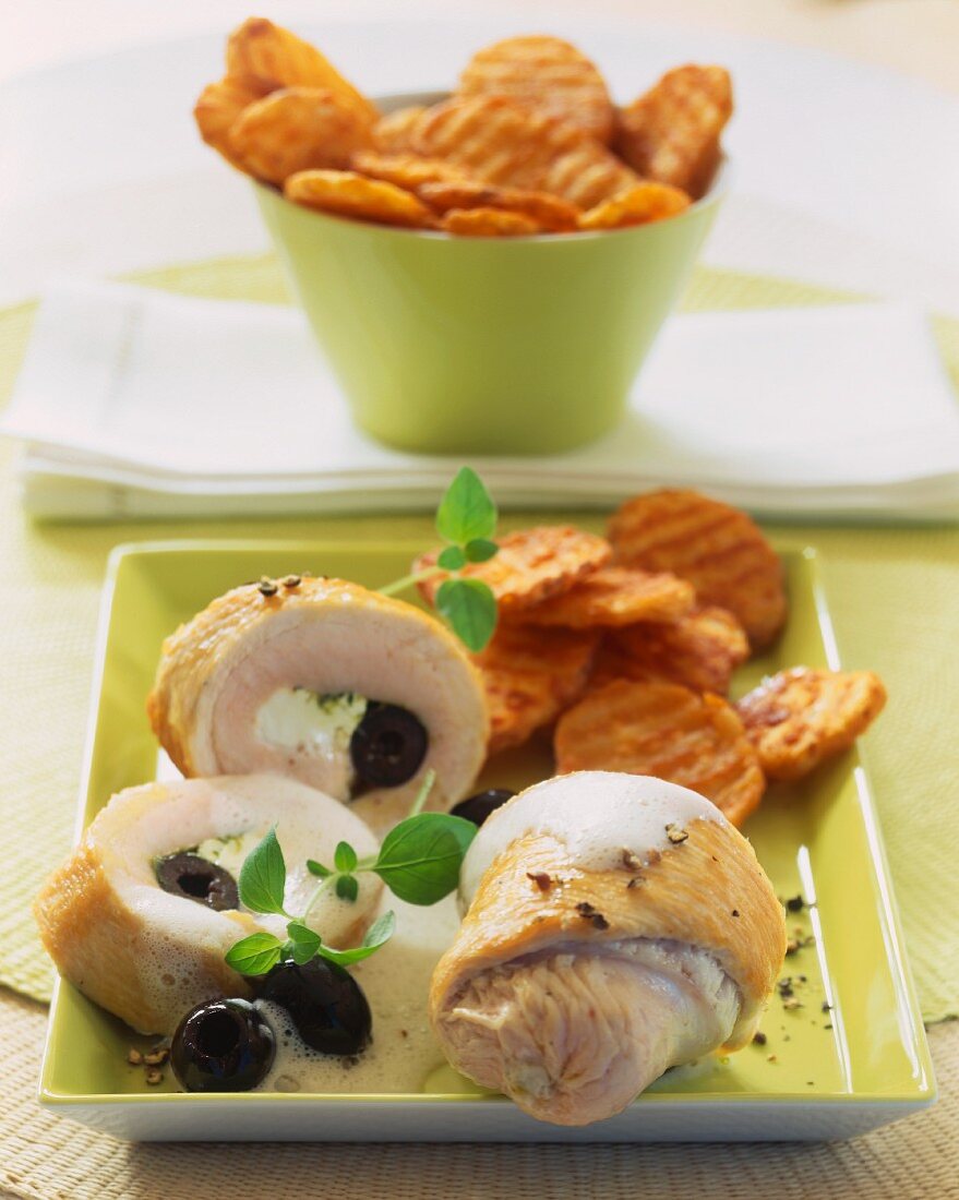 Turkey rolls with sheep cheese & olive filling & potato crisps