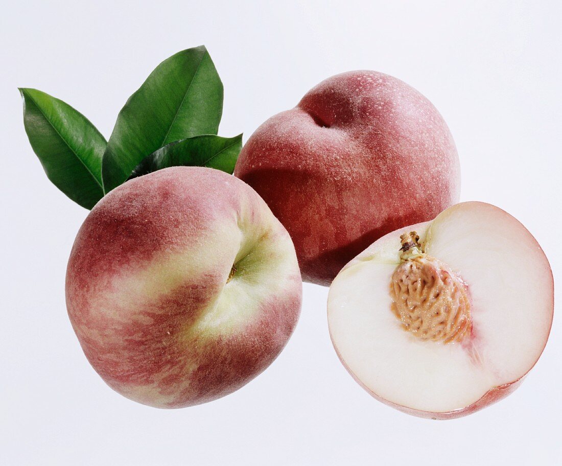 White peaches, two whole ones and one half