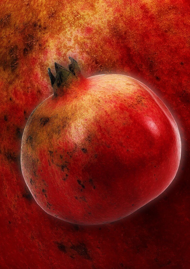 Ein Granatapfel, Hintergrund: vergrösserter Granatapfel