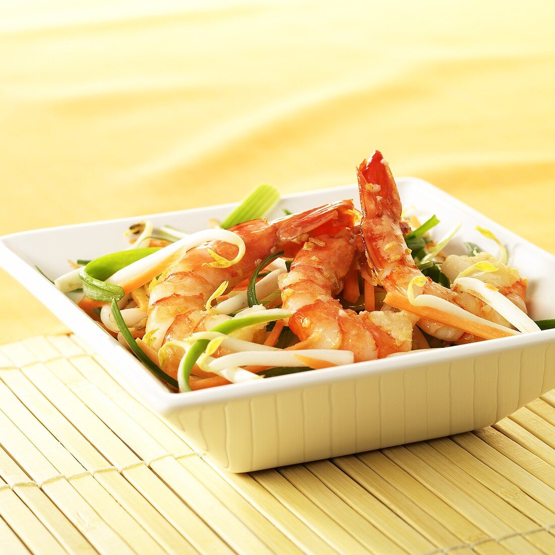 Three jumbo prawns with ginger and Asian vegetables