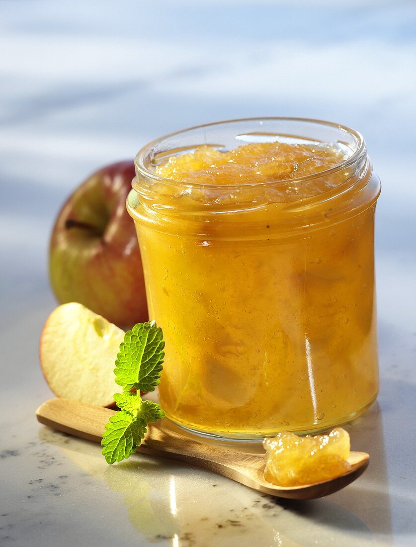 Apple preserve in jar and on spoon