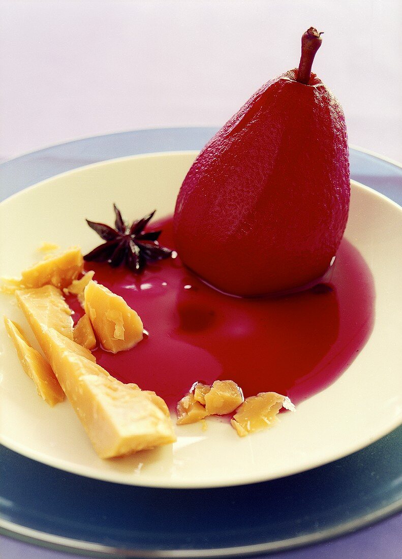 Red wine pear with cheese and star anise