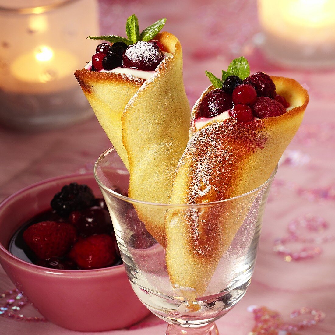 Baked wafer cones filled with berries and mousse