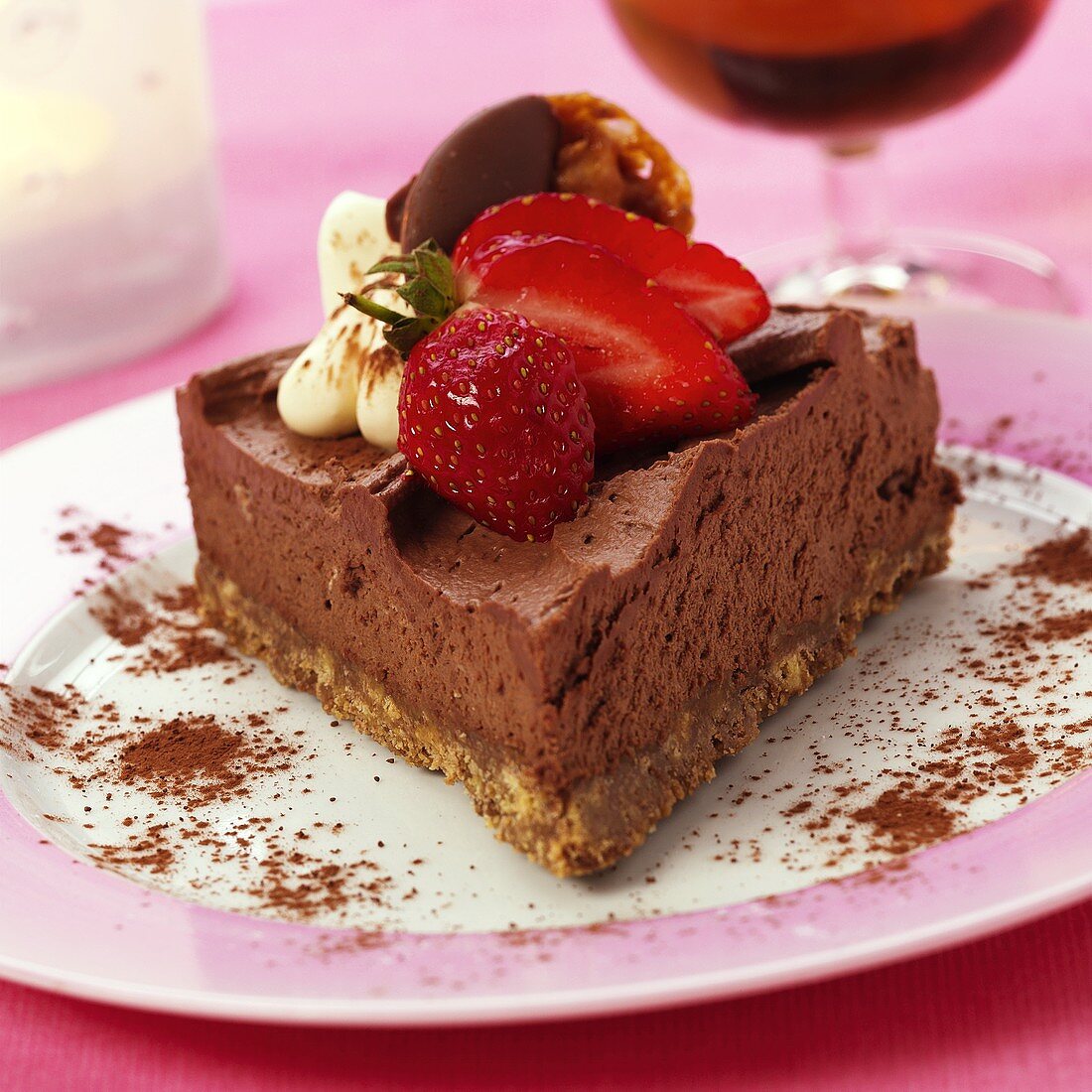 Piece of chocolate mousse gateau with strawberries