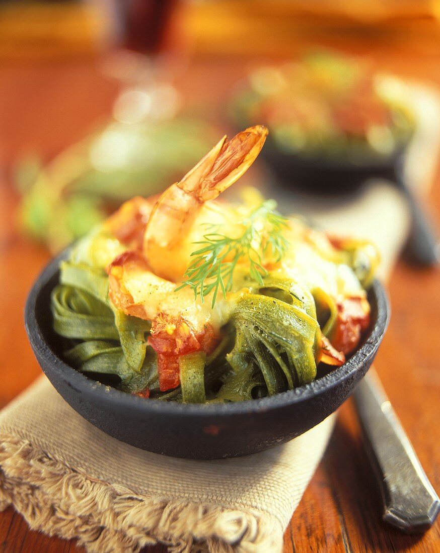 Green tagliatelle with shrimps au gratin