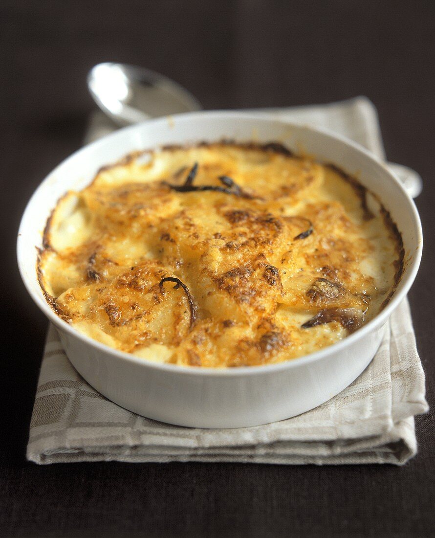 Gratin dauphinois (potato gratin) in round baking dish