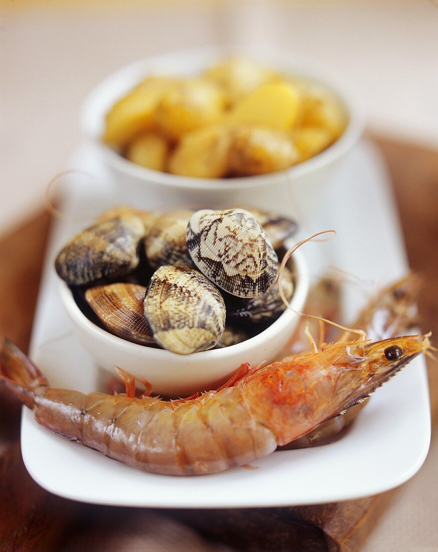Still life with shrimps, mussels and potatoes