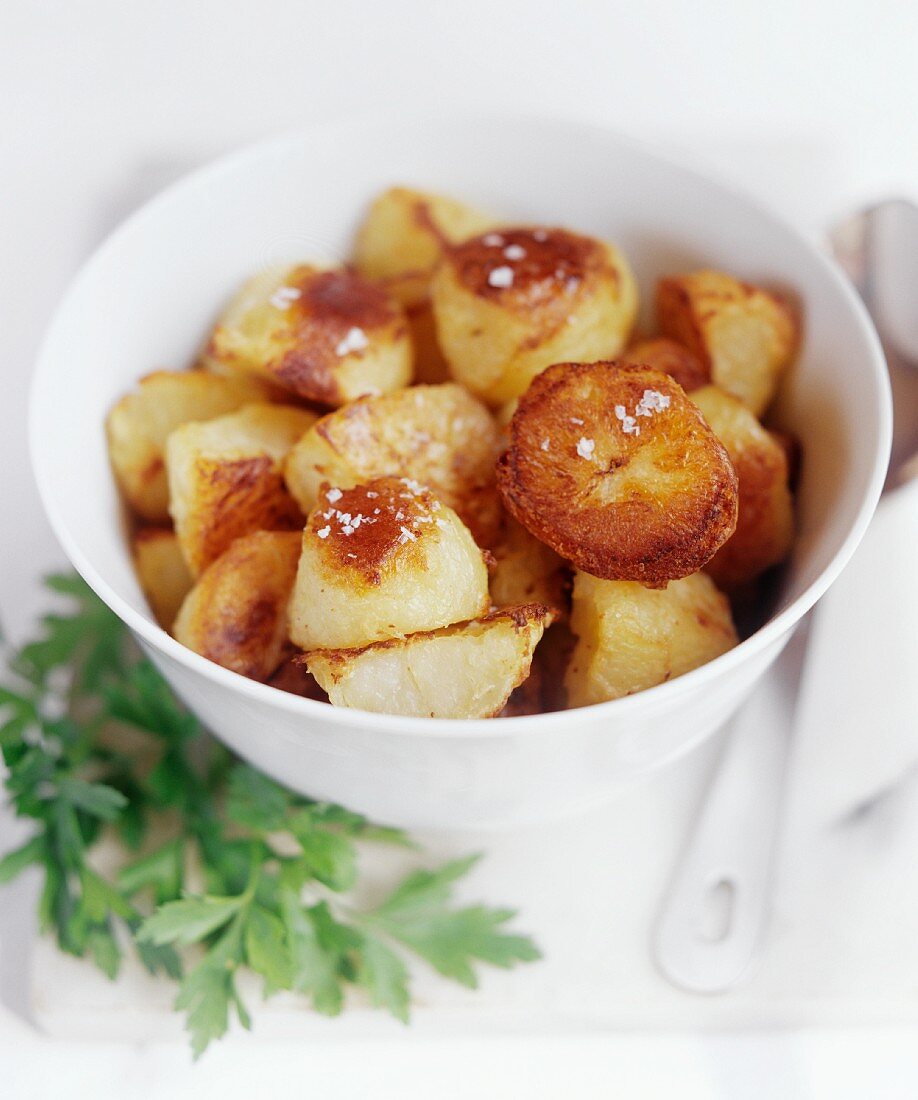 Roast potatoes in white bowl