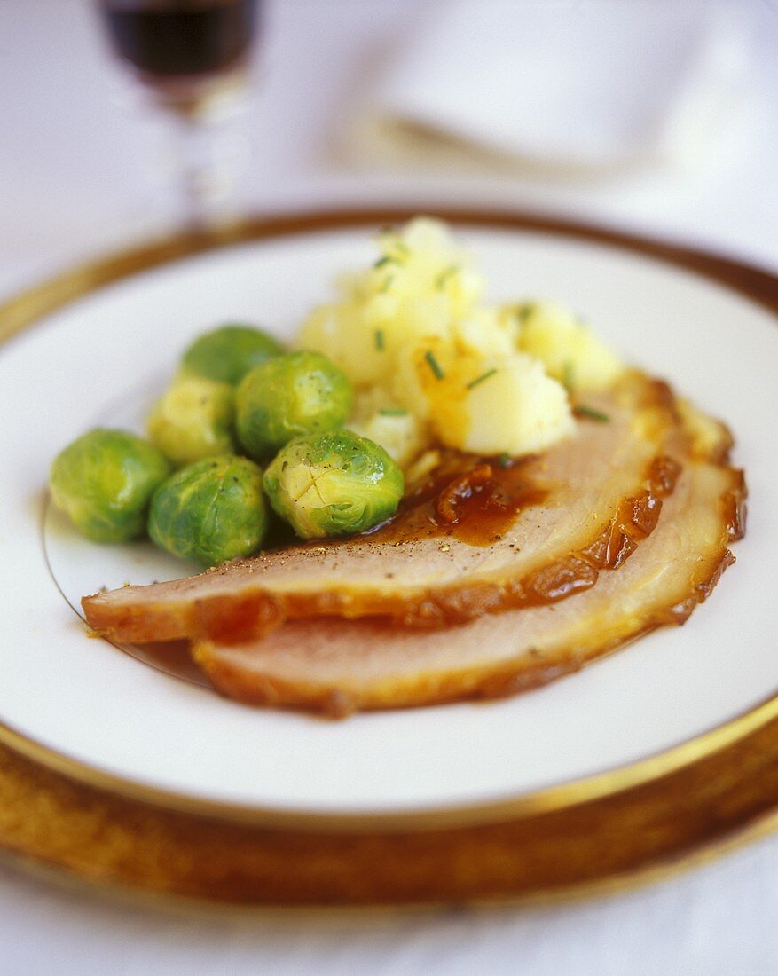 Glazed roast ham with Brussels sprouts and potatoes