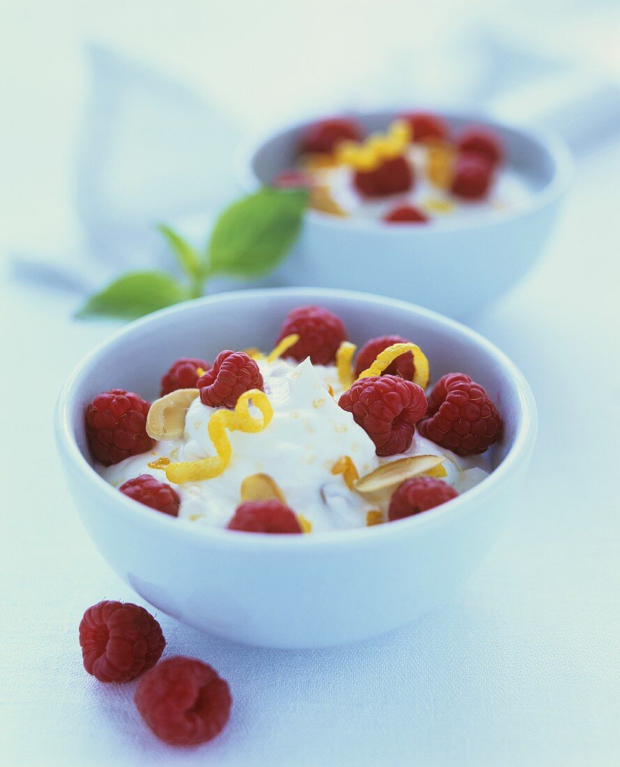Lemon ricotta cream with raspberries in bowl