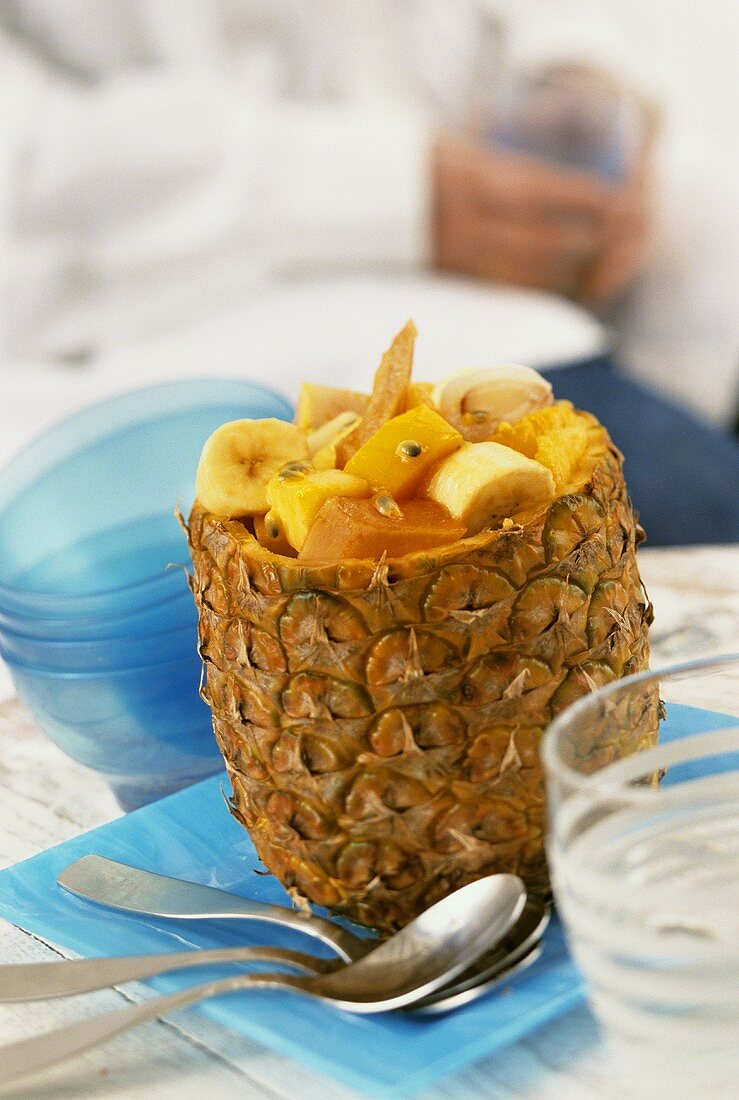 Tropical fruit salad, served in hollowed-out pineapple